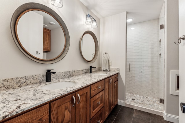 bathroom featuring vanity, tile patterned flooring, and an enclosed shower