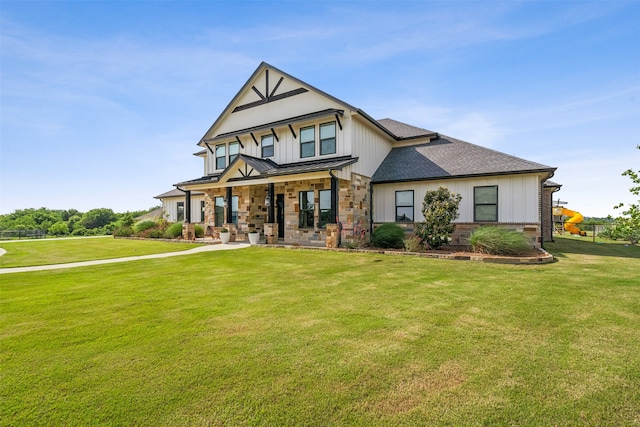 view of front facade with a front yard and a porch