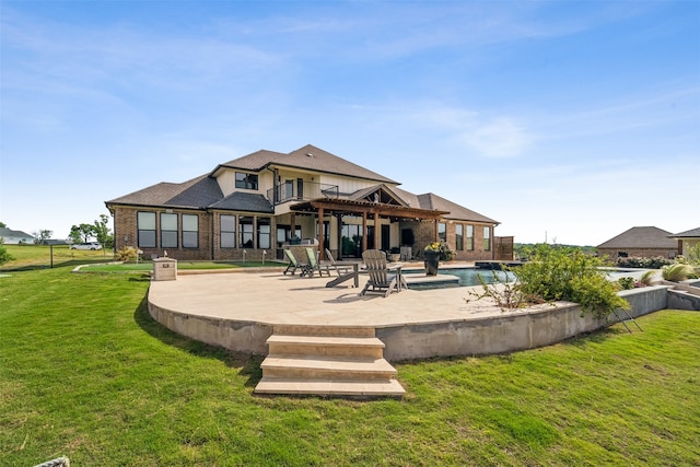 back of house featuring a patio area and a yard