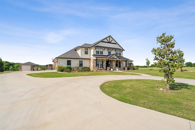 view of front of house with a porch, a garage, and a front yard