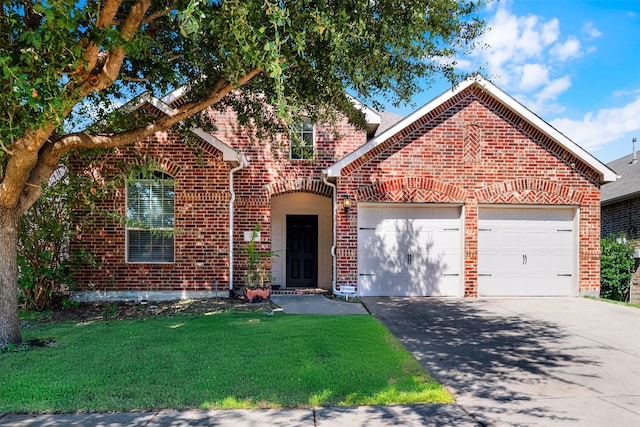 front of property featuring a front yard and a garage