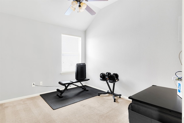 workout room with ceiling fan, lofted ceiling, and carpet flooring