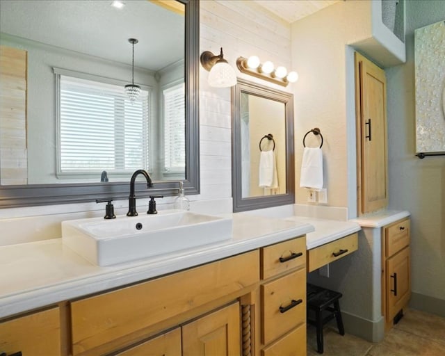 bathroom with wooden walls, tile patterned flooring, and vanity