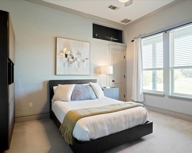 carpeted bedroom featuring ornamental molding