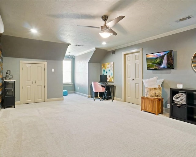 office area featuring ceiling fan, a textured ceiling, ornamental molding, and carpet