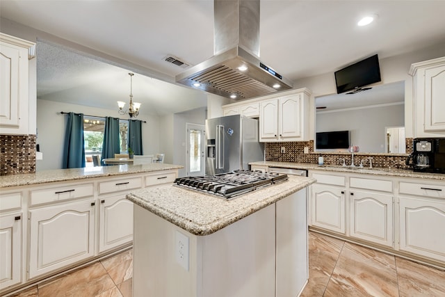 kitchen featuring stainless steel appliances, backsplash, kitchen peninsula, and island range hood