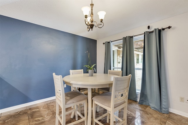 dining room featuring a chandelier