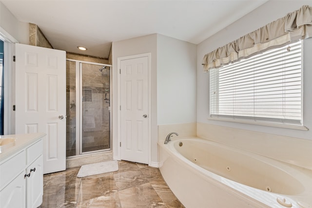 bathroom with independent shower and bath and vanity