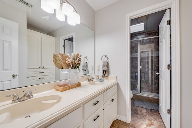 bathroom with vanity, toilet, and an enclosed shower