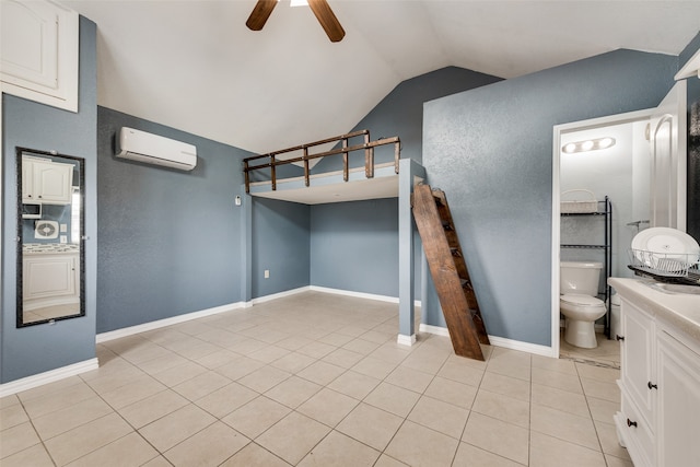 interior space with vanity, ceiling fan, toilet, a wall mounted AC, and tile patterned floors