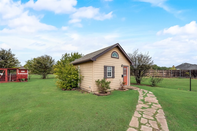 view of outbuilding with a lawn