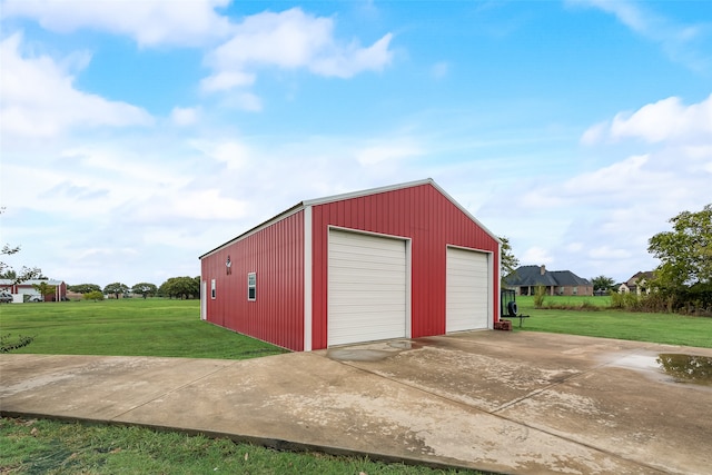 garage featuring a lawn