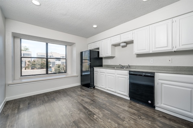 kitchen featuring black appliances, sink, a textured ceiling, white cabinets, and dark wood-type flooring