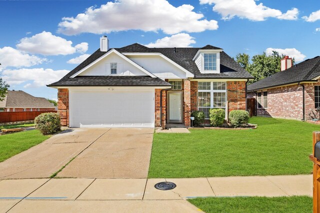 view of front of house with a garage and a front lawn