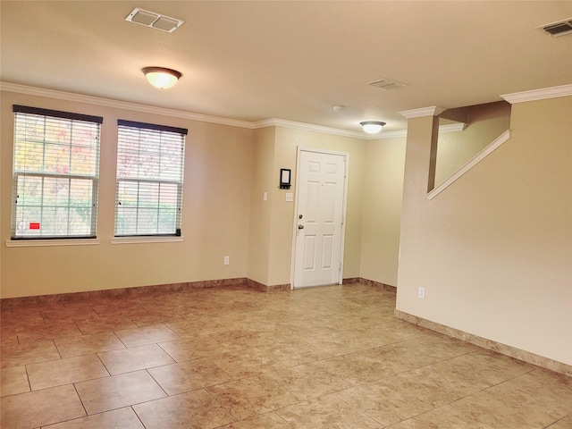 unfurnished room featuring crown molding