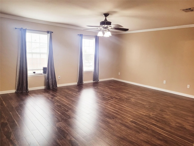 spare room with crown molding, ceiling fan, and dark wood-type flooring