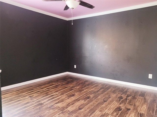 unfurnished room with ceiling fan, dark hardwood / wood-style floors, and ornamental molding