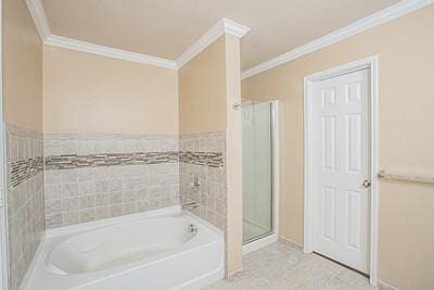 bathroom with tile patterned floors, ornamental molding, tile walls, and independent shower and bath