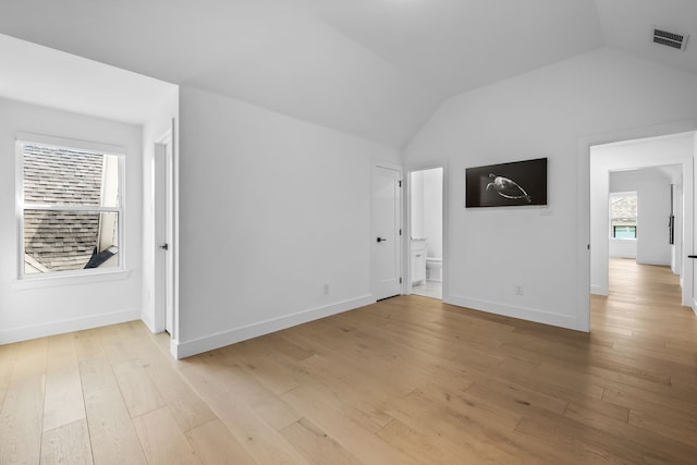 interior space with light hardwood / wood-style flooring and lofted ceiling