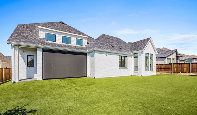 back of house featuring a lawn