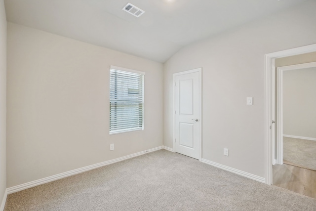 unfurnished bedroom featuring light carpet