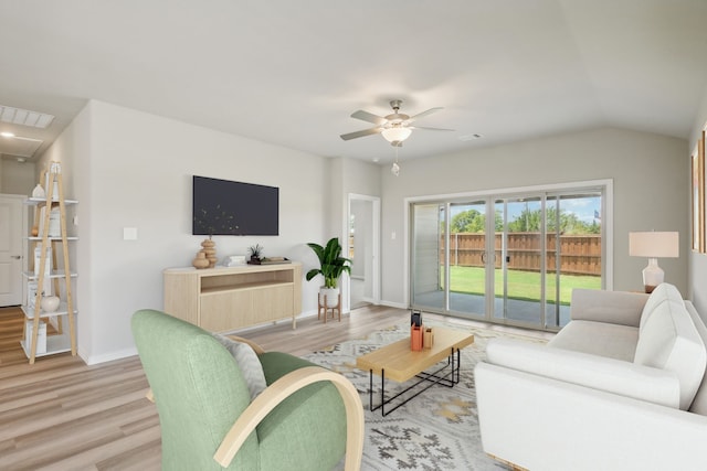 empty room with ceiling fan, light hardwood / wood-style flooring, and lofted ceiling