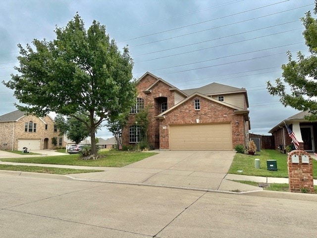 front of property featuring a front lawn and a garage