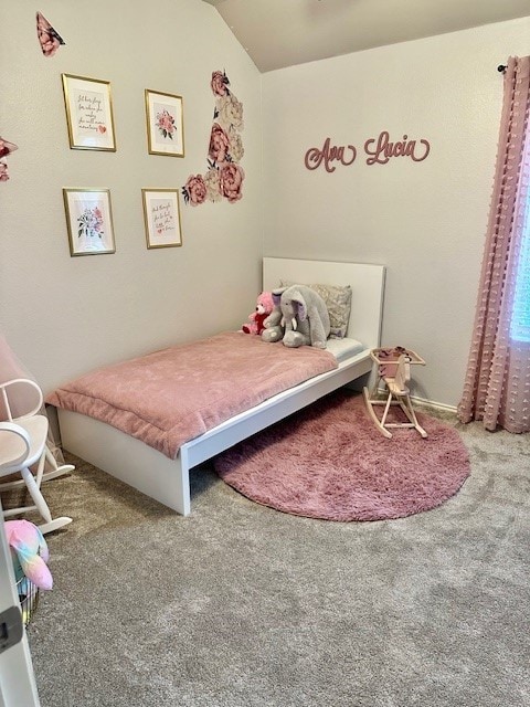 carpeted bedroom featuring vaulted ceiling