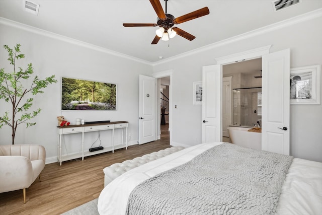 bedroom featuring ornamental molding, connected bathroom, ceiling fan, and hardwood / wood-style floors