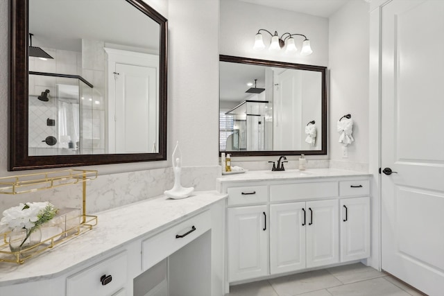 bathroom with walk in shower and vanity