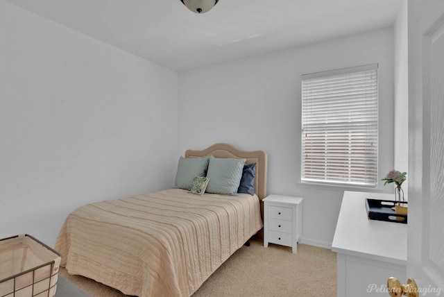 bedroom with light carpet