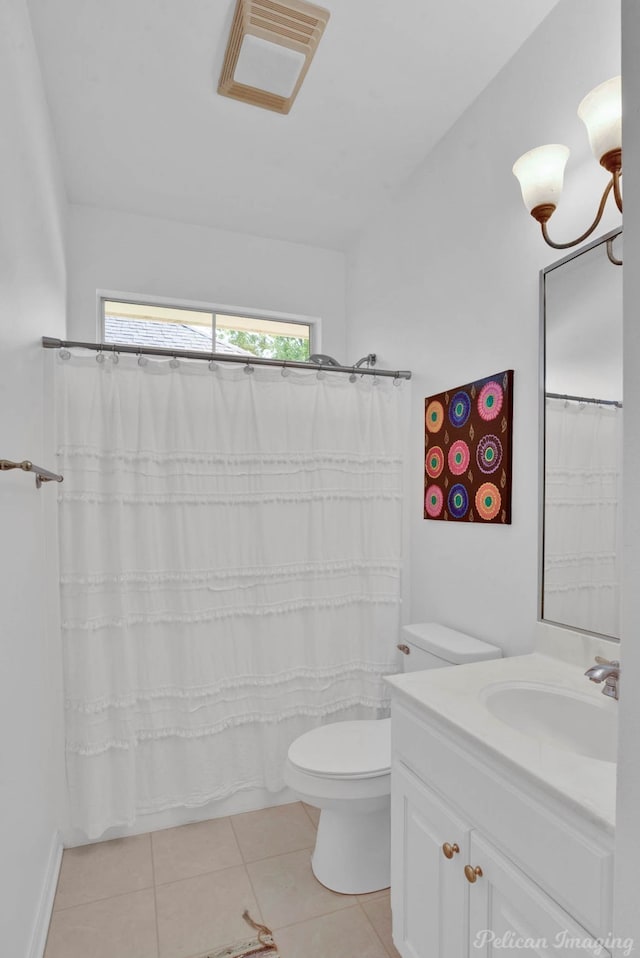 bathroom with tile patterned flooring, a shower with shower curtain, vanity, and toilet