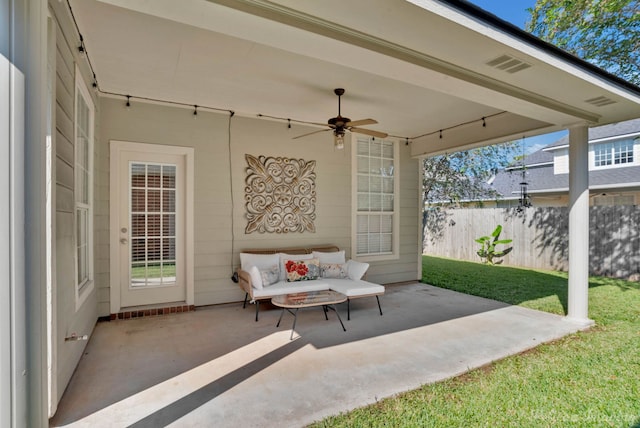 view of patio featuring ceiling fan