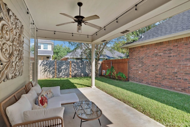 view of patio with an outdoor living space and ceiling fan