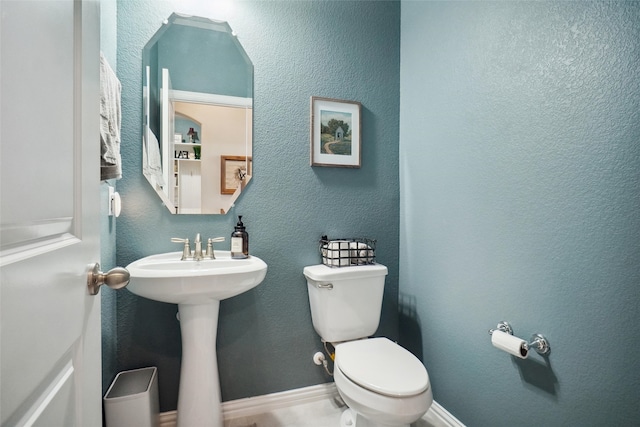 bathroom featuring sink and toilet