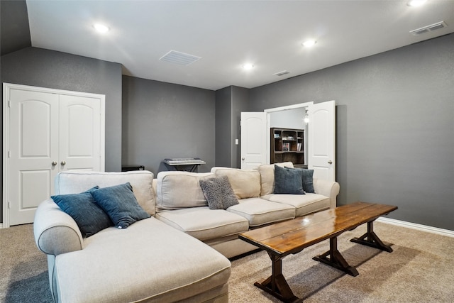 living room with carpet floors and vaulted ceiling