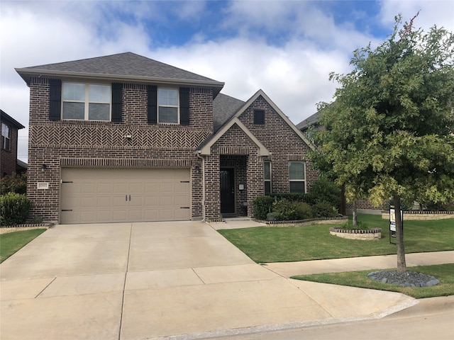 view of front facade with a front yard and a garage