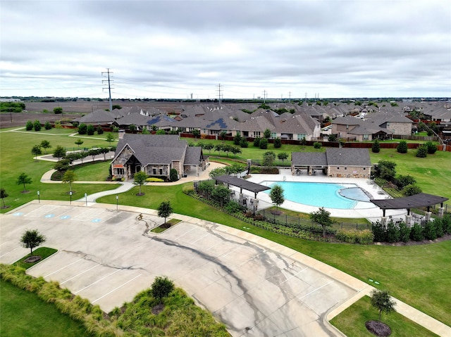 view of swimming pool featuring a yard and a patio area