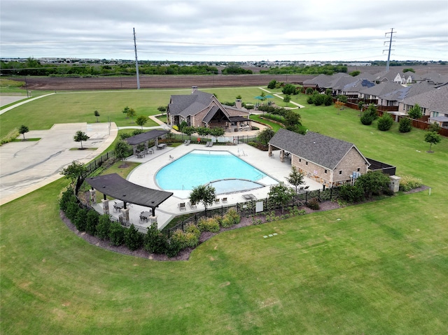 view of swimming pool featuring a yard and a patio