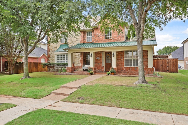 view of front of house featuring a front yard and a porch