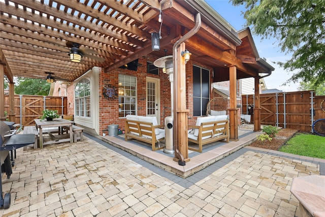 view of patio featuring a pergola, ceiling fan, and outdoor lounge area