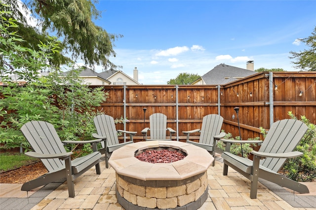 view of patio featuring an outdoor fire pit