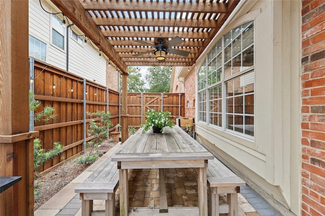 view of patio / terrace with a pergola and ceiling fan