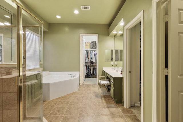 bathroom with vanity, separate shower and tub, and tile patterned flooring