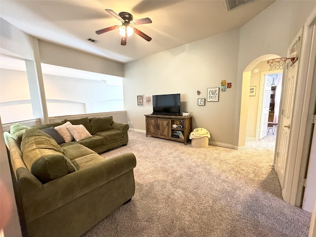 living room featuring carpet and ceiling fan