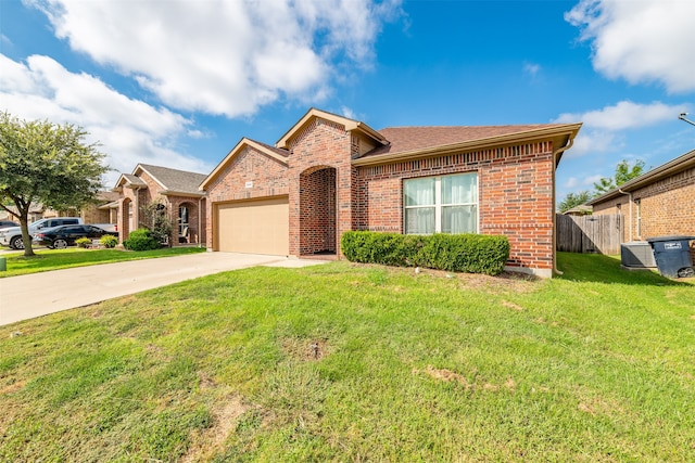 view of front of property with a garage and a front lawn