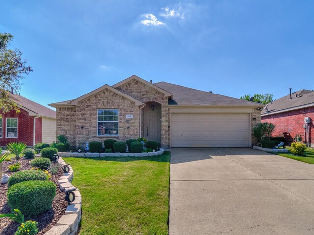 ranch-style home featuring a front lawn and a garage