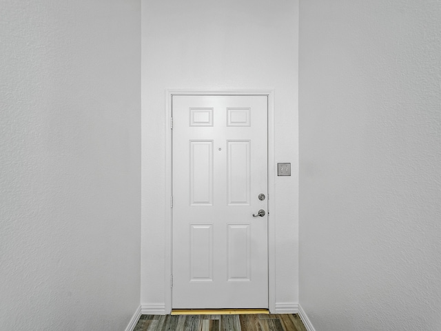 doorway to outside featuring dark hardwood / wood-style floors