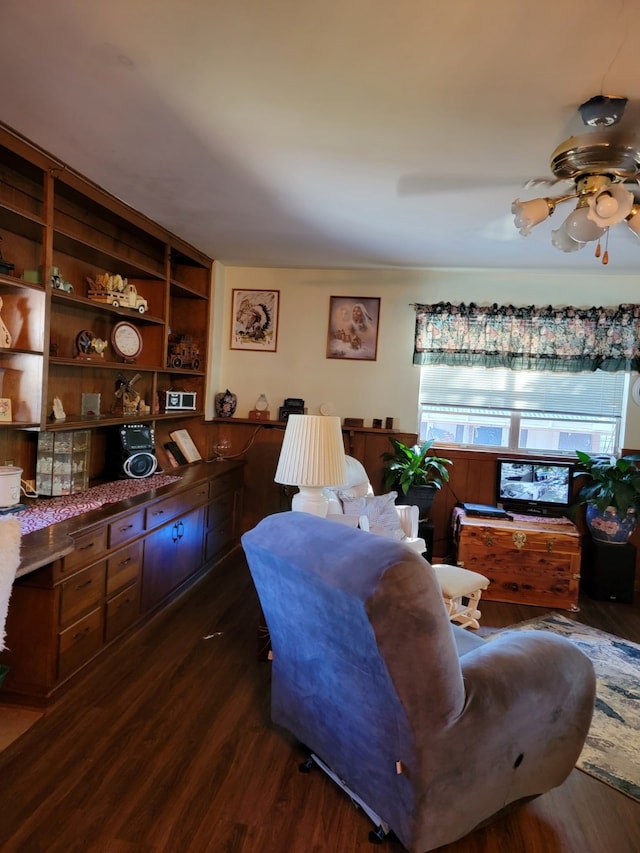 living room with ceiling fan, dark hardwood / wood-style floors, and built in features