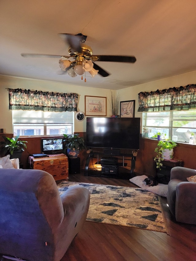 living room with ceiling fan and dark hardwood / wood-style floors